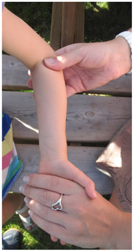 photograph demonstrating hand position for the supination technique